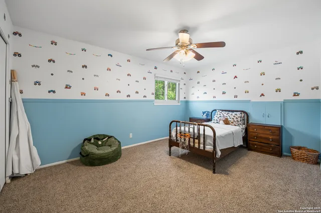 a bedroom with a bed and window