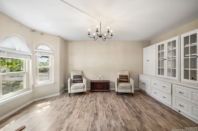 a bedroom with furniture and window