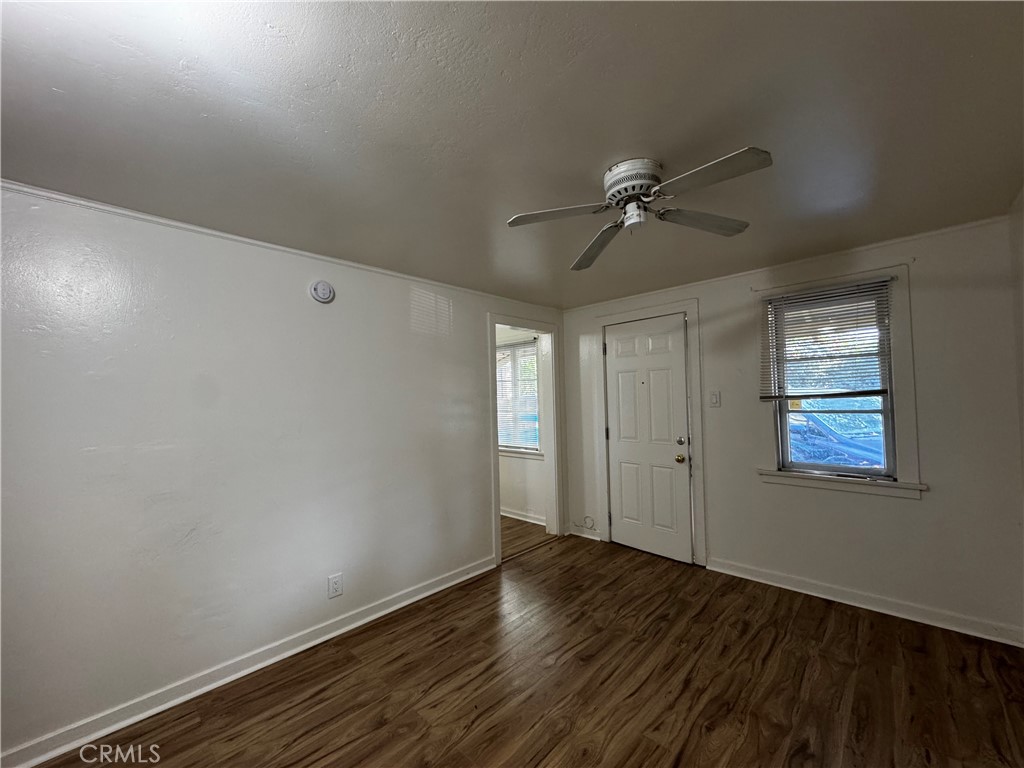 2726 5th Street, Unit 4 Riverside, CA 92507 - Photo 6 of 12 wooden floor in an empty room with a window