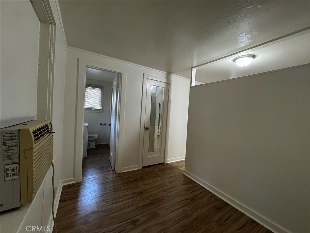 2726 5th Street, Unit 4 Riverside, CA 92507 - Photo 7 of 12 a view of a room with wooden floor and a bathroom