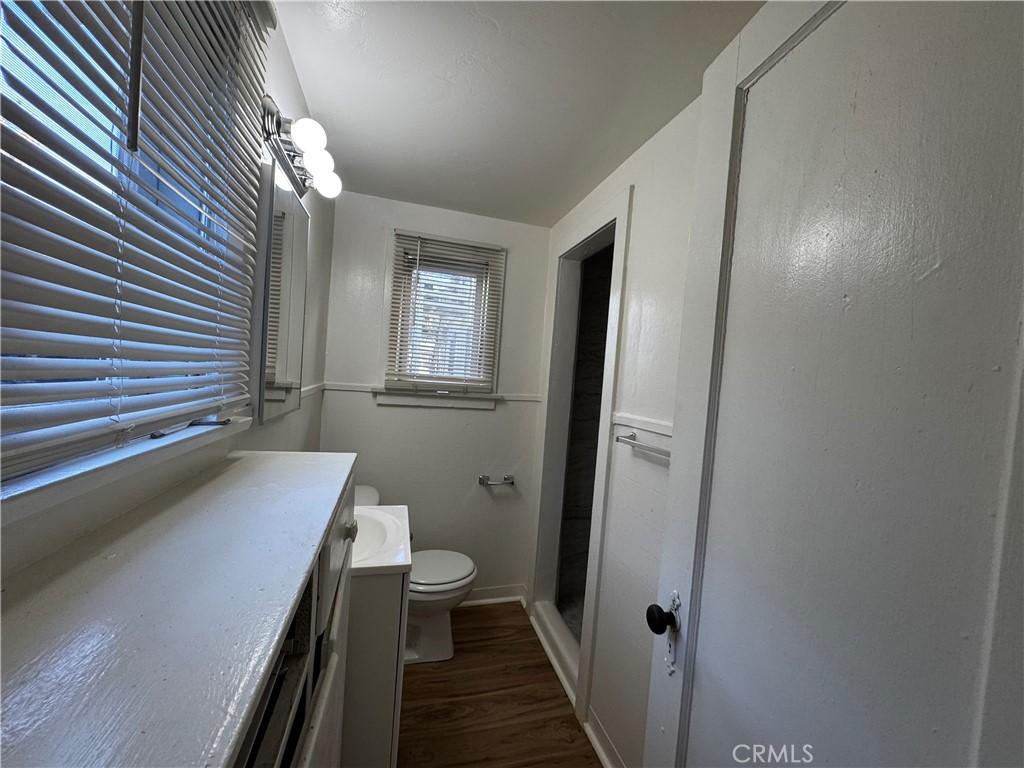 2726 5th Street, Unit 4 Riverside, CA 92507 - Photo 10 of 12 a bathroom with a sink a toilet and shower