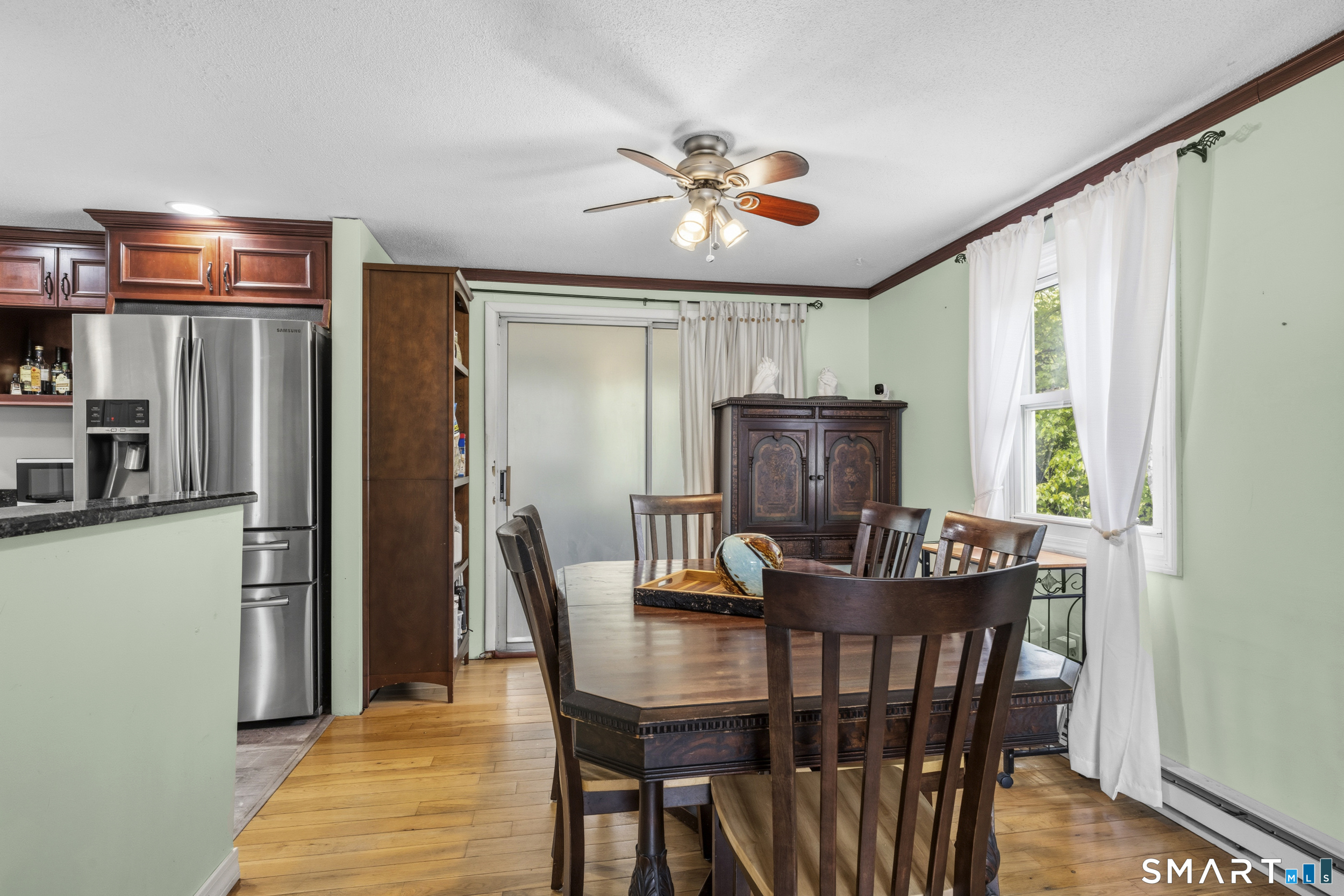 90 Sturtevant Street Norwich, CT 06360 - Photo 10 of 40 Ceiling fan and half wall to separate the dining room from the kitchen