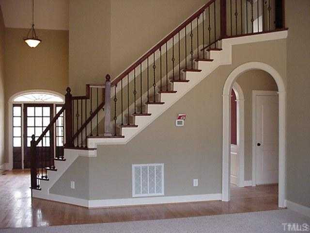 60 North Sunset Ridge Drive Willow Spring, NC 27592 - Photo 10 of 12 Arches and detail in the family room stairway/foyer view. Staircase