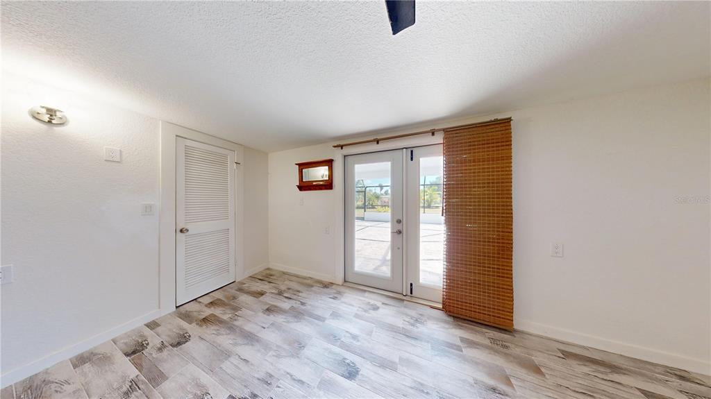 6057 Florida Street Punta Gorda, FL 33950 - Photo 27 of 29 an empty room with closet and windows