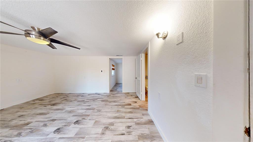 6057 Florida Street Punta Gorda, FL 33950 - Photo 28 of 29 a view of a room with a ceiling fan