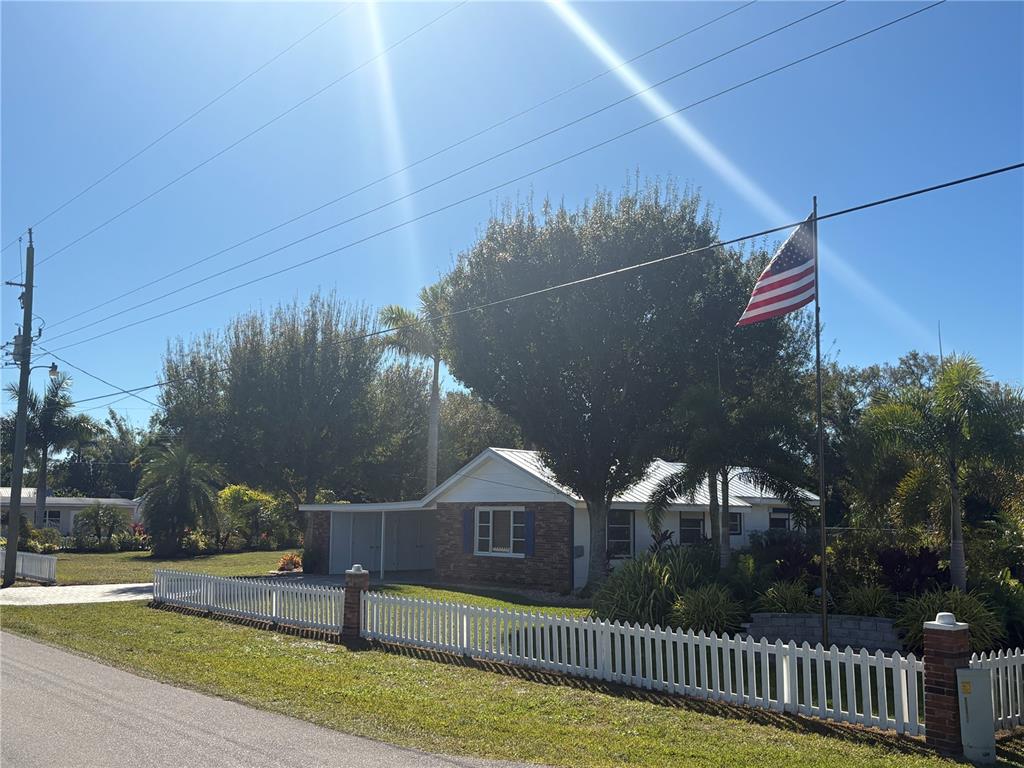 6057 Florida Street Punta Gorda, FL 33950 - Photo 4 of 29 a view of a house with a yard
