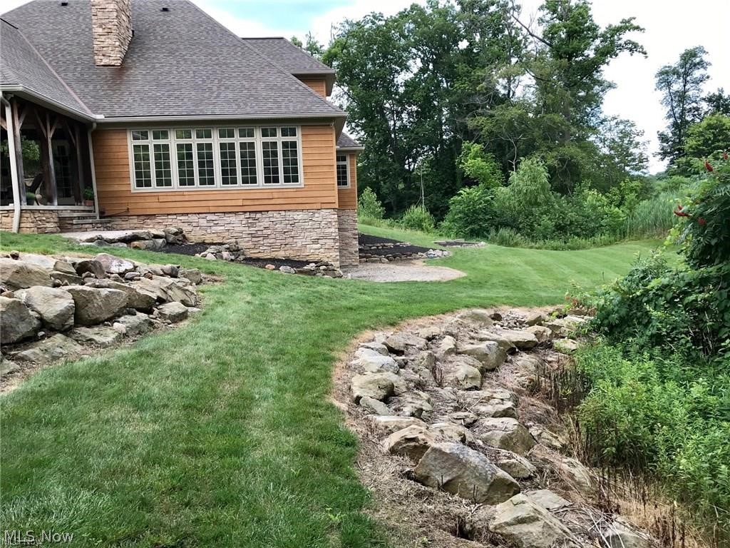 12430 Falcon Ridge Road Chesterland, OH 44026 - Photo 21 of 28 Beautiful stone detail on this home and huge
walk-out basement ready for your finishing
touches...walk out has great area for stone patio