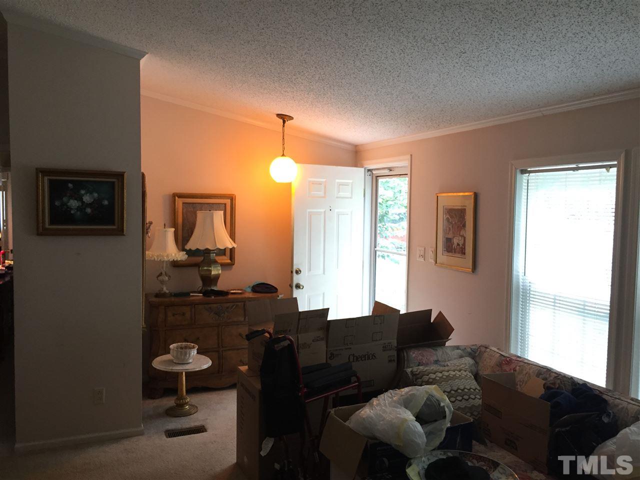 1136 Holeman Ashley Road Timberlake, NC 27583 - Photo 2 of 20 a living room with furniture wooden floor and a window