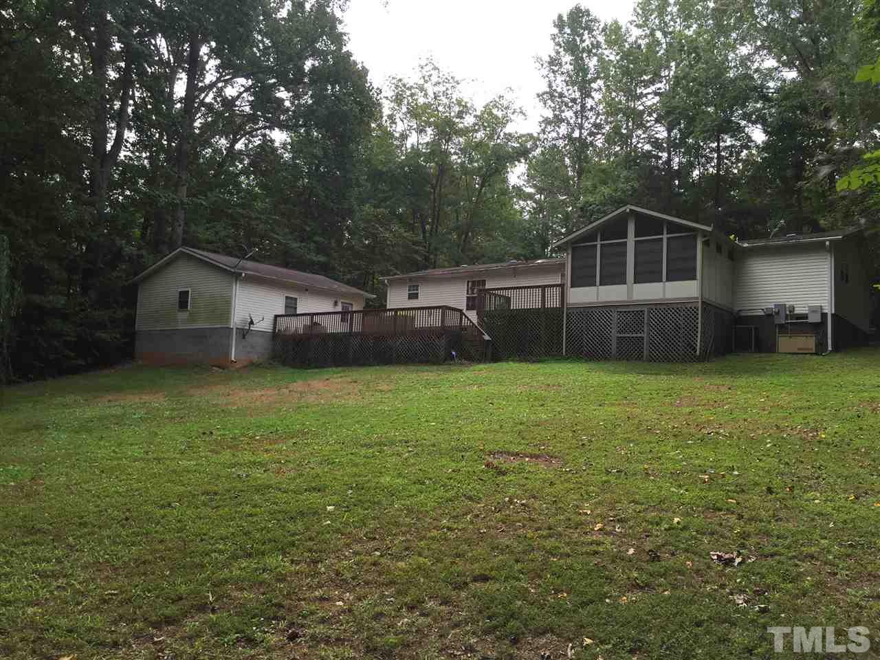 1136 Holeman Ashley Road Timberlake, NC 27583 - Photo 19 of 20 a front view of a house with a garden