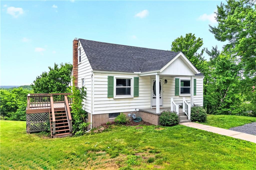 124 Bunker Hill Road Aliquippa, PA 15001 - Photo 2 of 37 a front view of a house with a yard