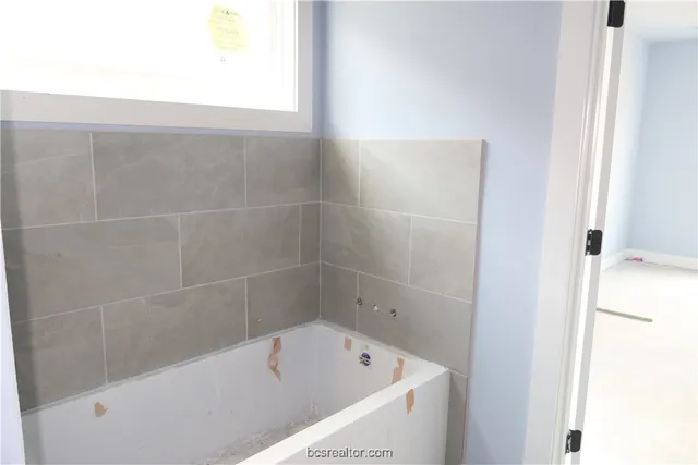 a bathroom with a bathtub