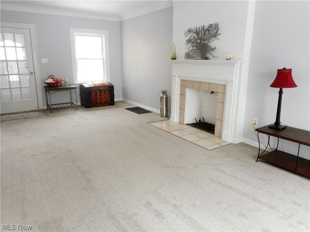 3554 Tullamore Road Cleveland, OH 44118 - Photo 8 of 28 Living Room with Brand New Carpeting, a door between the Vestibule and a Wood or Gas Burning Fireplace.