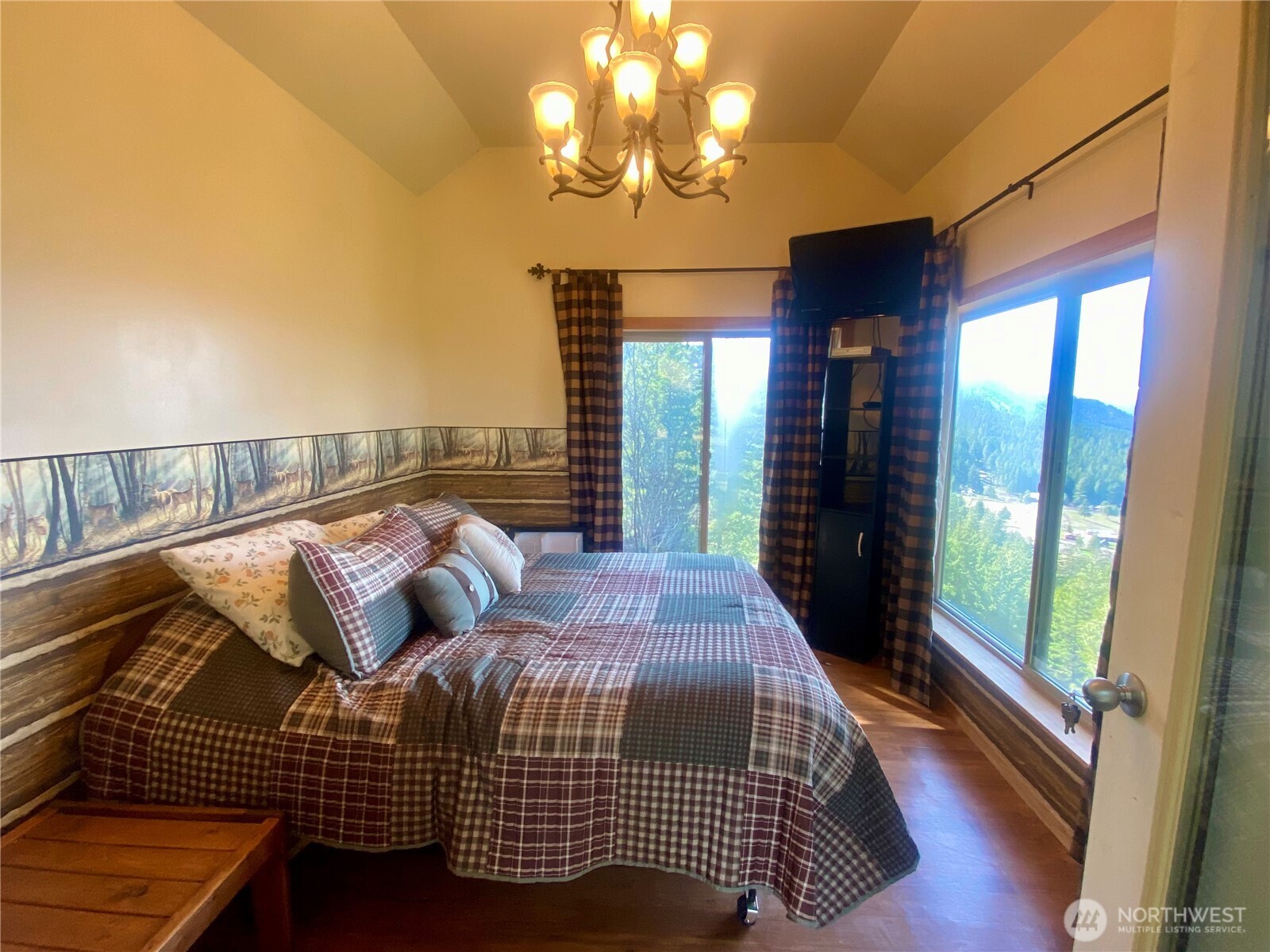 393 Tom And Nita Road Cle Elum, WA 98922 - Photo 13 of 30 a bed sitting in a bedroom next to a window