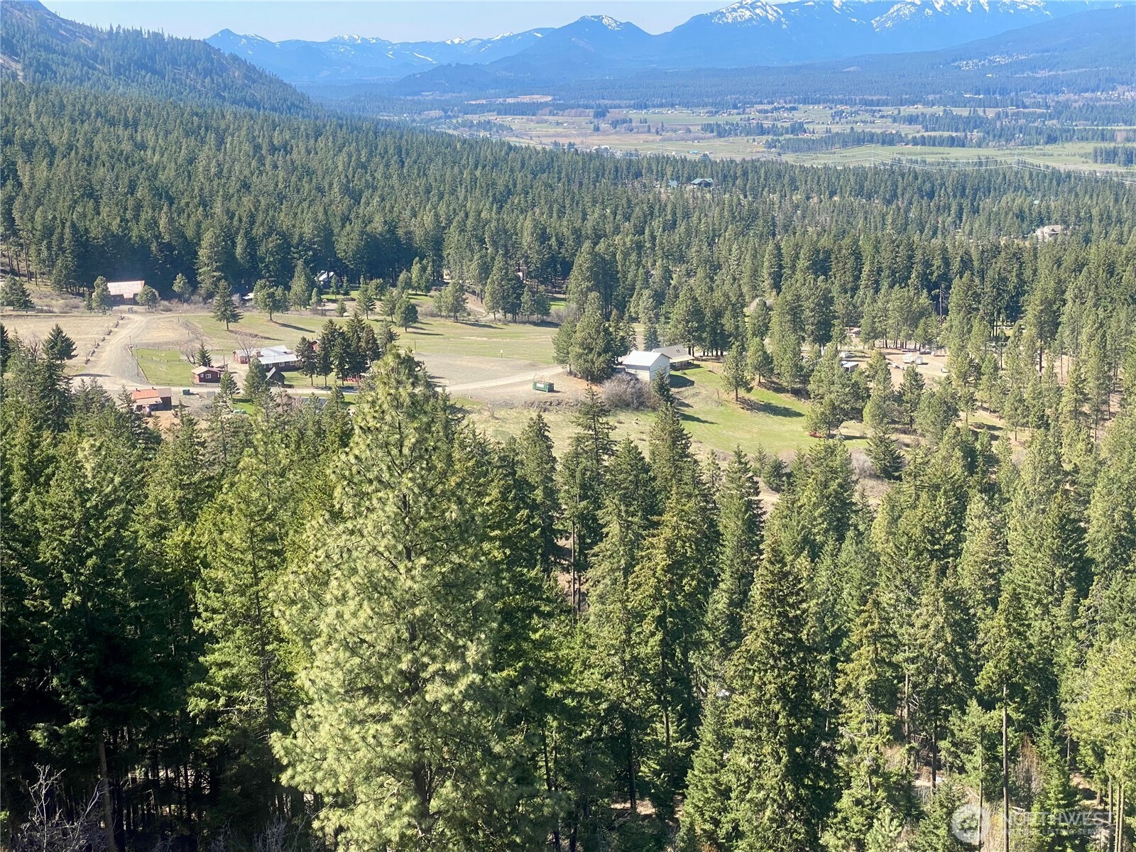 393 Tom And Nita Road Cle Elum, WA 98922 - Photo 2 of 30 a view of a lake with mountains in the background