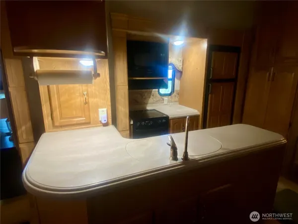 a bed room with a bed and a television