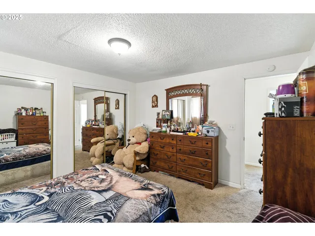 a bedroom with a bed and furniture