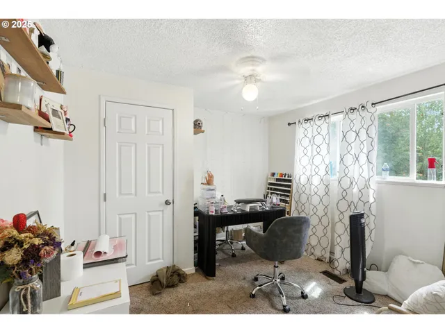 a workspace with furniture and a window