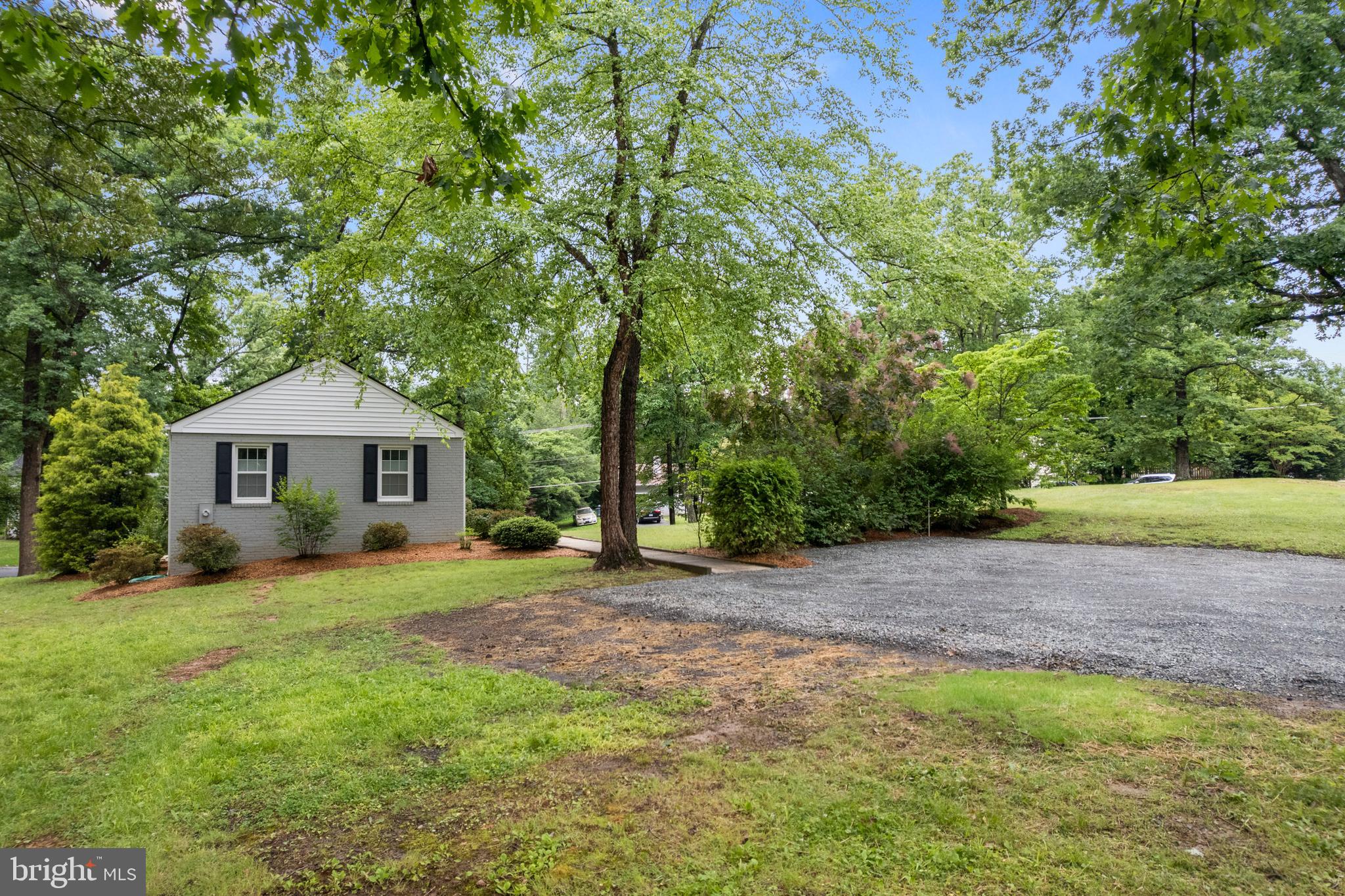 12131 Waples Mill Road Oakton, VA 22124 - Photo 26 of 40 a front view of a house with a yard and trees