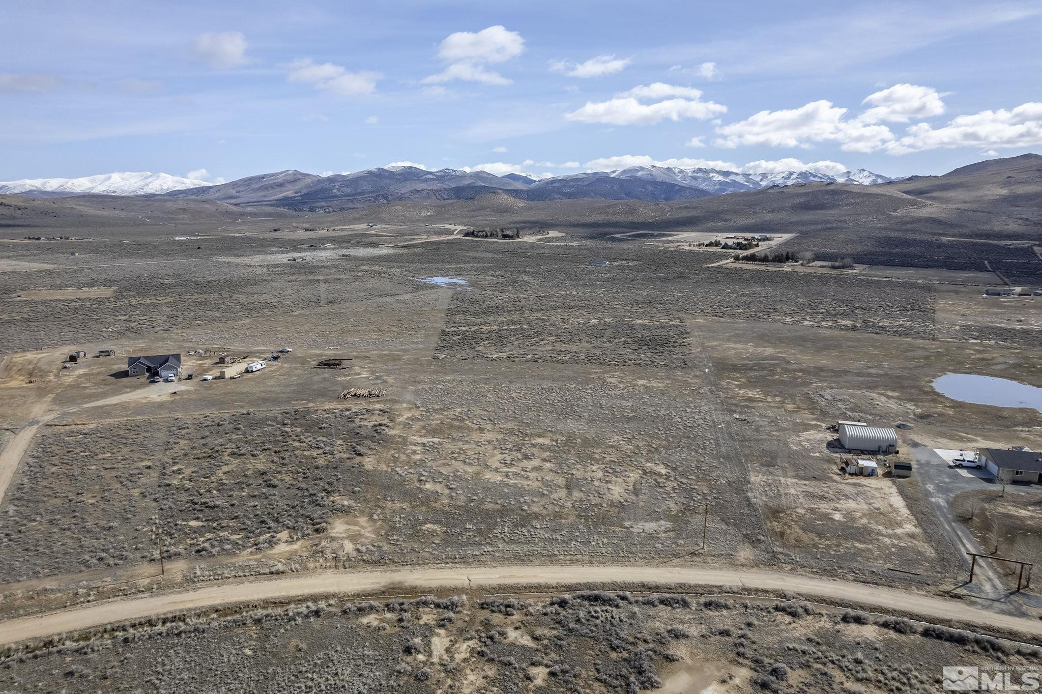 115 Buckboard Circle Reno, NV 89508 - Photo 2 of 17 a view of a lake with mountains in the background