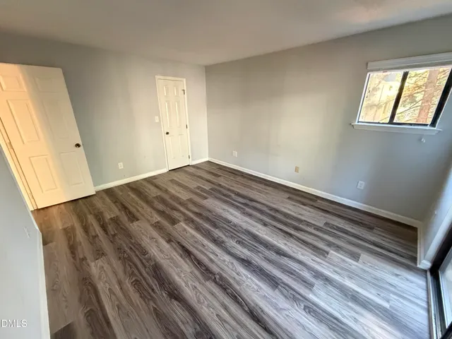 a view of an empty room and window