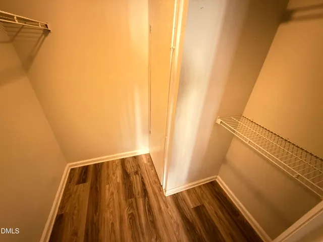 a view of a balcony with wooden floor