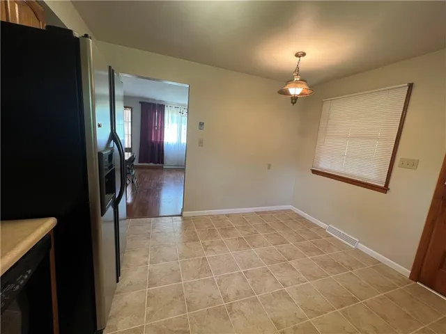 wooden floor in a hall with a mirror