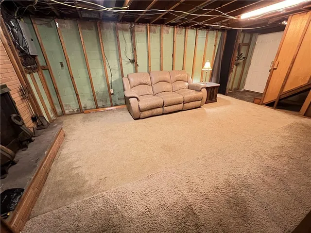 a bedroom with a bed window and a shower