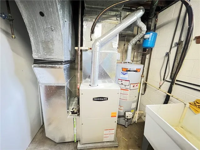 a view of storage and utility room with washer and dryer