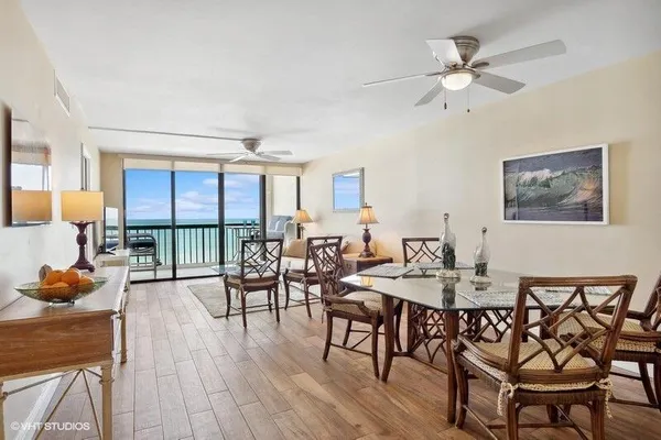 a view of a dining room with furniture window and wooden floor
