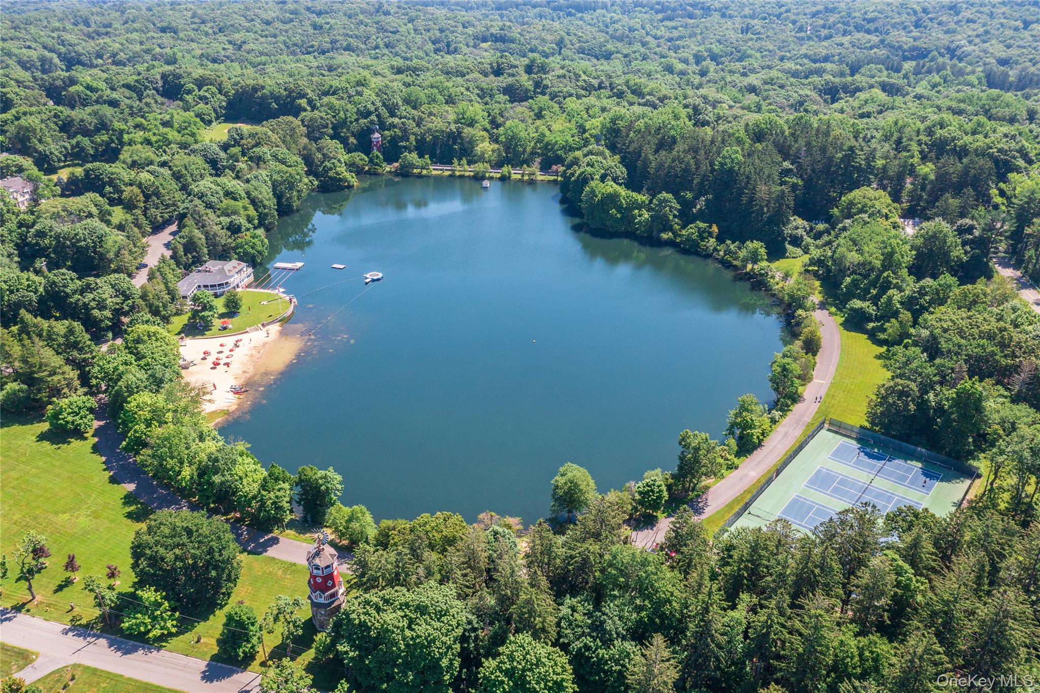 65 Windmill Road Armonk, NY 10504 - Photo 31 of 37 an aerial view of a house with a yard and lake view