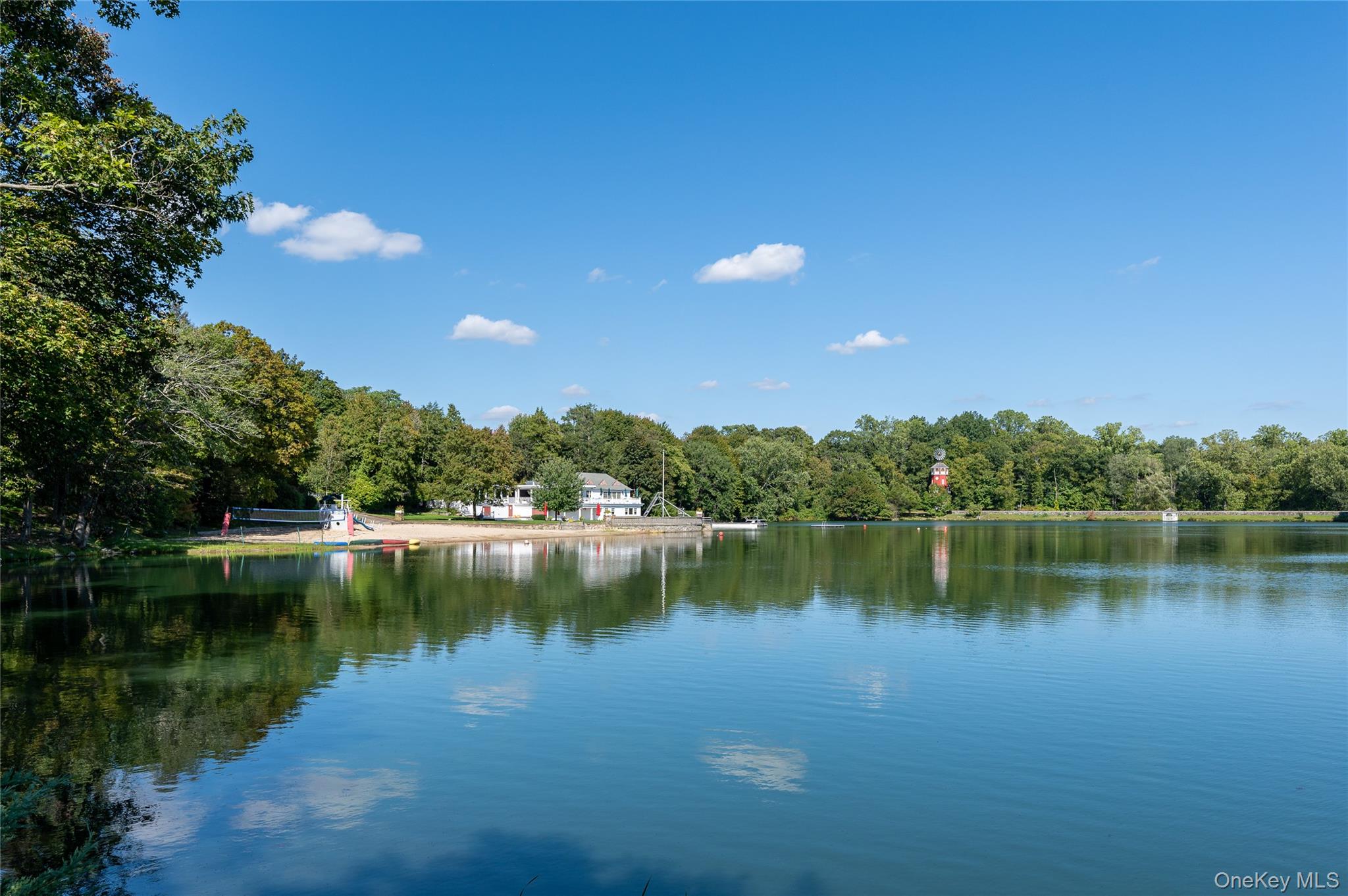 65 Windmill Road Armonk, NY 10504 - Photo 34 of 37 a view of a lake with a yard