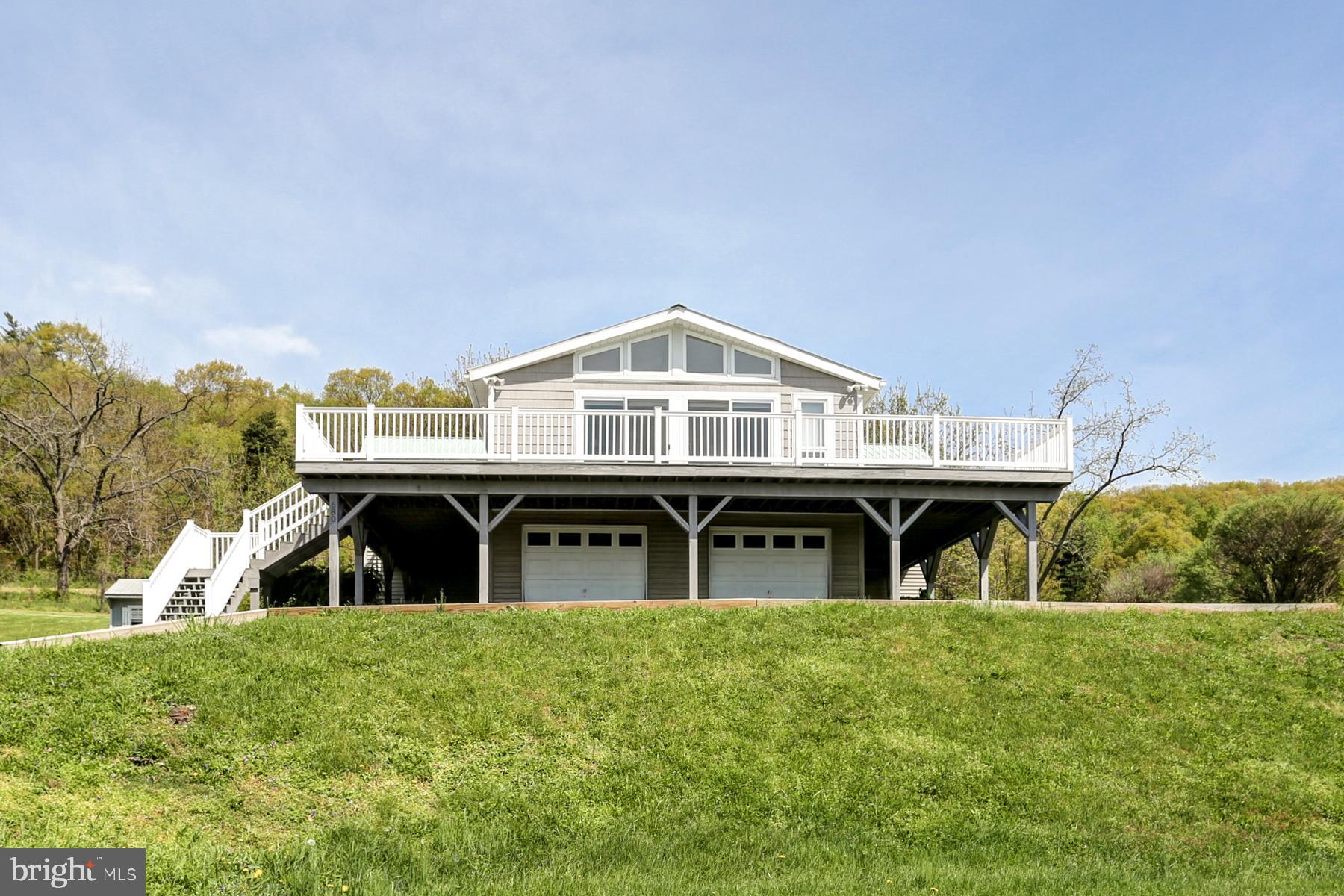 680 Powells Valley Road Halifax, PA 17032 - Photo 1 of 44 a view of a house with a backyard porch and sitting area