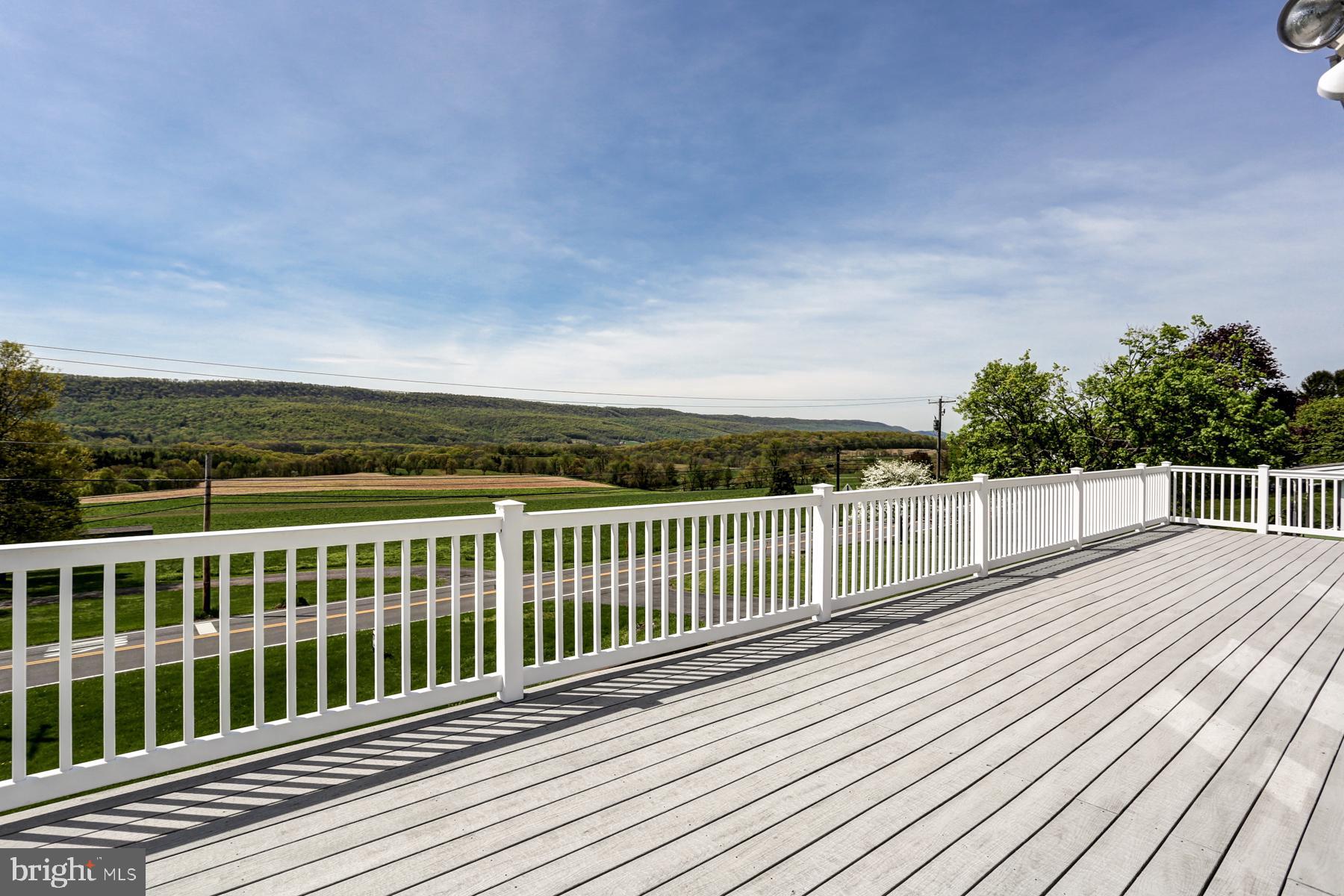 680 Powells Valley Road Halifax, PA 17032 - Photo 2 of 44 a view of balcony with wooden floor and fence