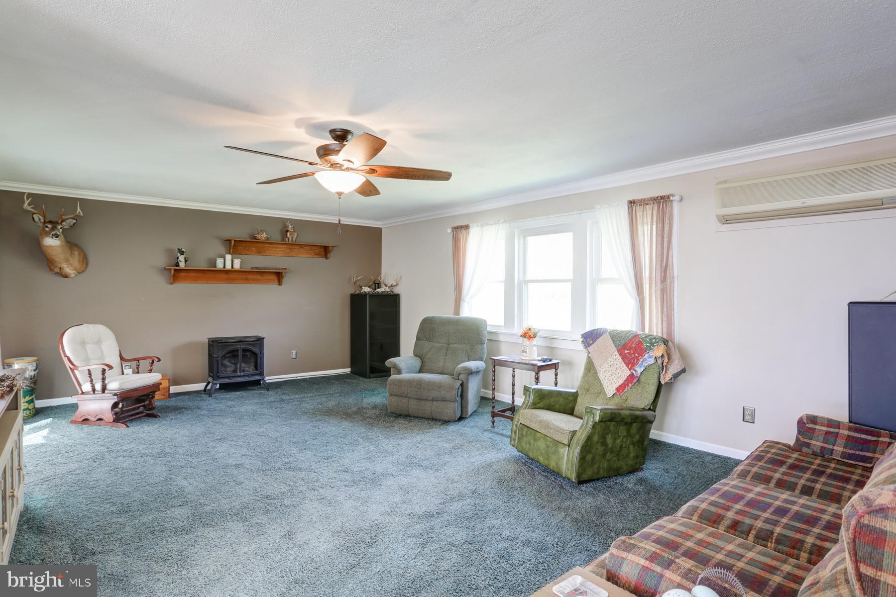 680 Powells Valley Road Halifax, PA 17032 - Photo 12 of 44 a living room with furniture and a window