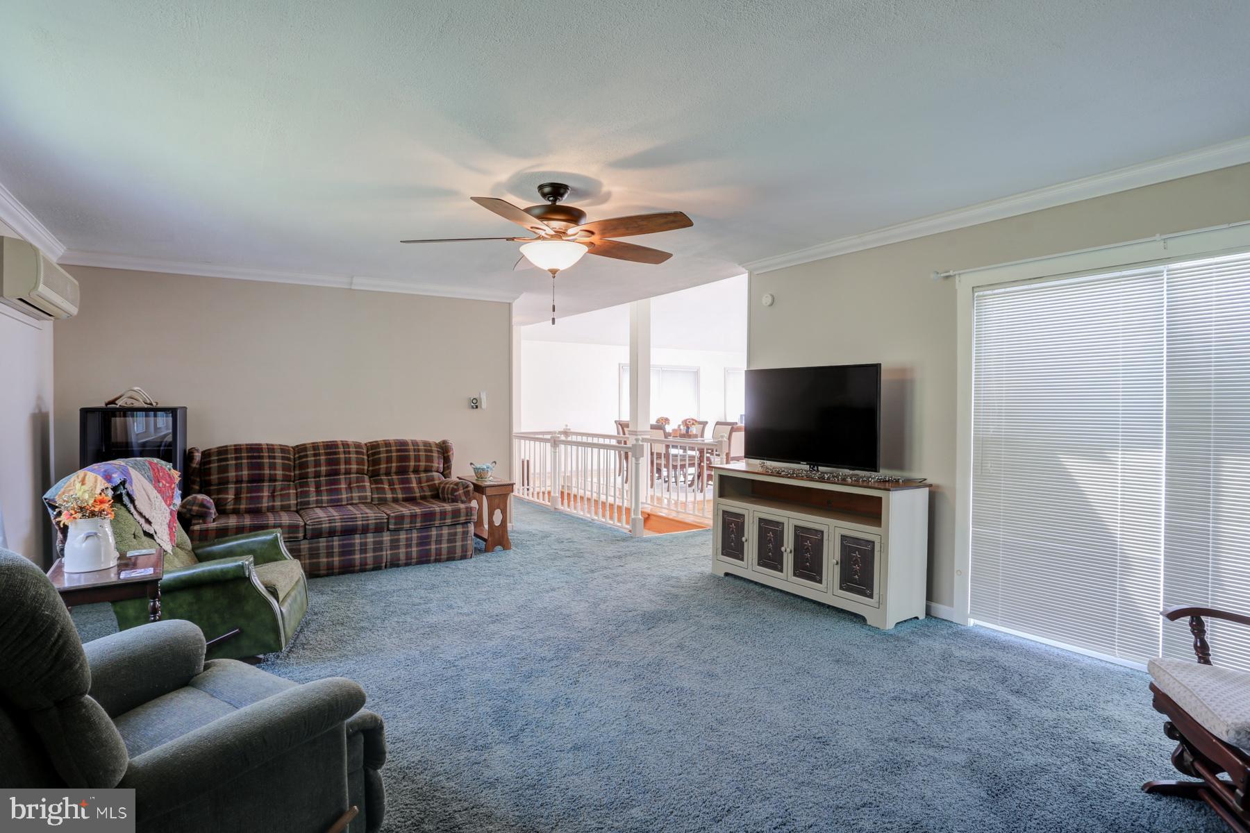 680 Powells Valley Road Halifax, PA 17032 - Photo 13 of 44 a living room with furniture and a flat screen tv