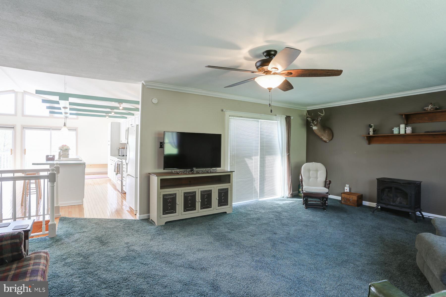 680 Powells Valley Road Halifax, PA 17032 - Photo 14 of 44 a view of a livingroom with furniture and a flat screen tv