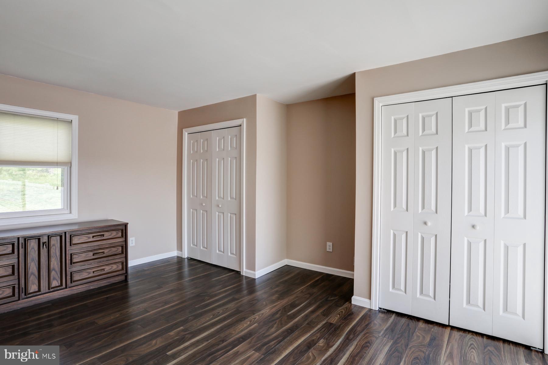 680 Powells Valley Road Halifax, PA 17032 - Photo 15 of 44 an empty room with wooden floor and windows