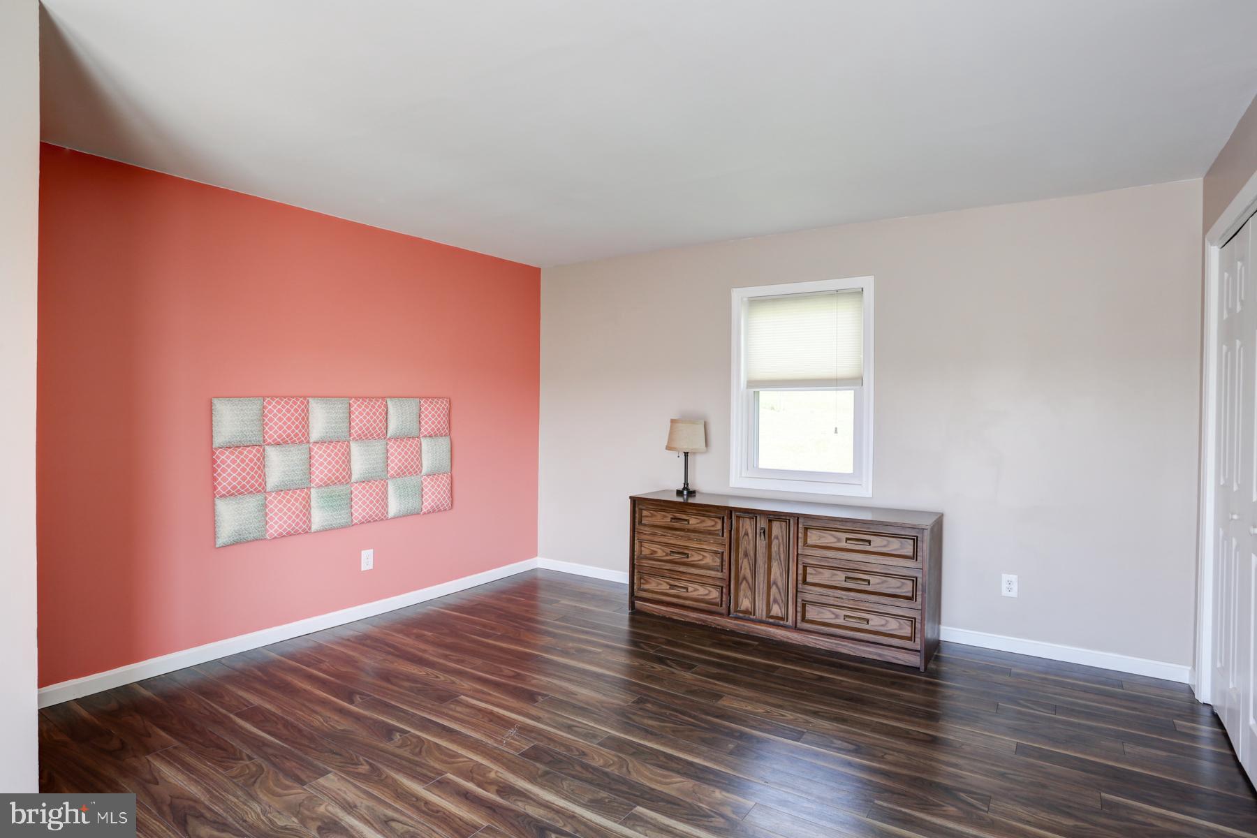680 Powells Valley Road Halifax, PA 17032 - Photo 16 of 44 a view of an empty room with window and wooden floor