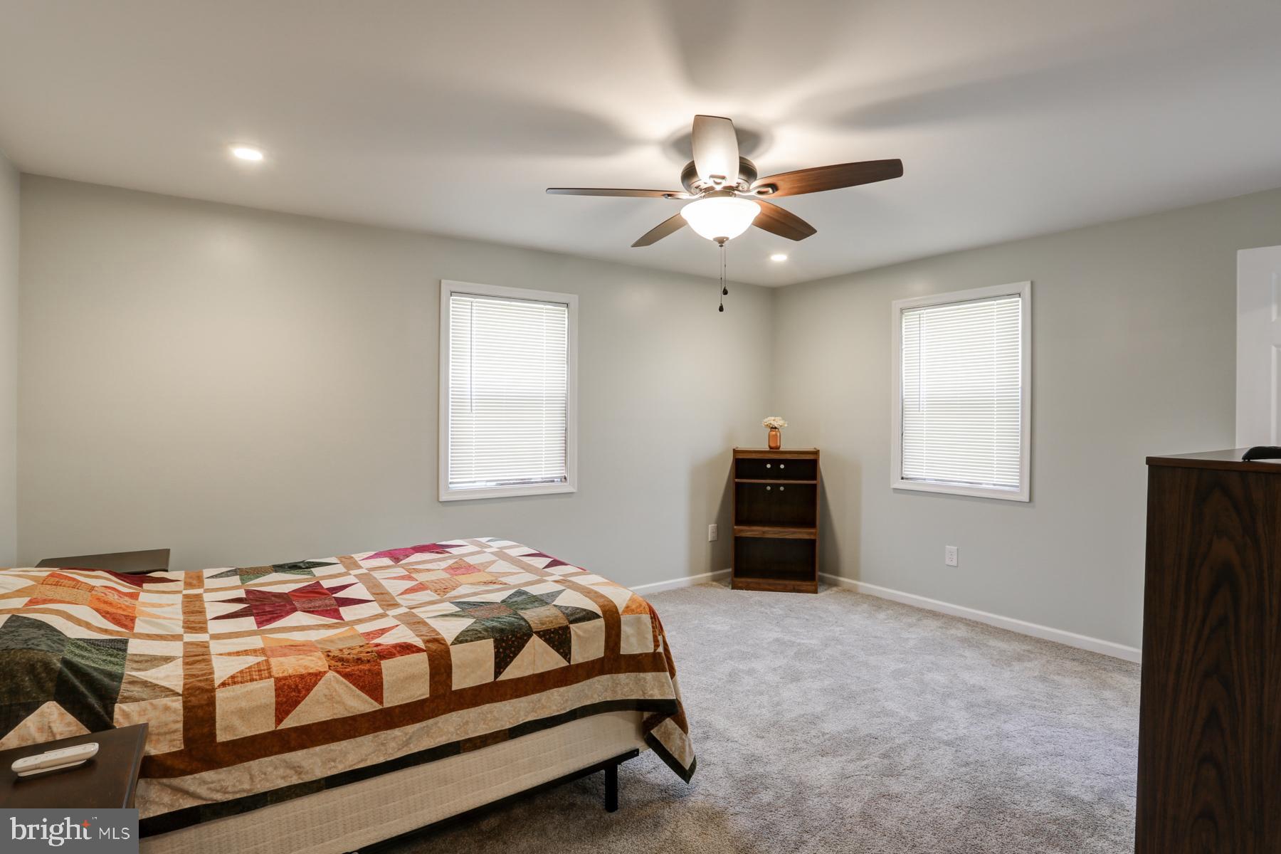 680 Powells Valley Road Halifax, PA 17032 - Photo 19 of 44 a bedroom with a bed and a chandelier