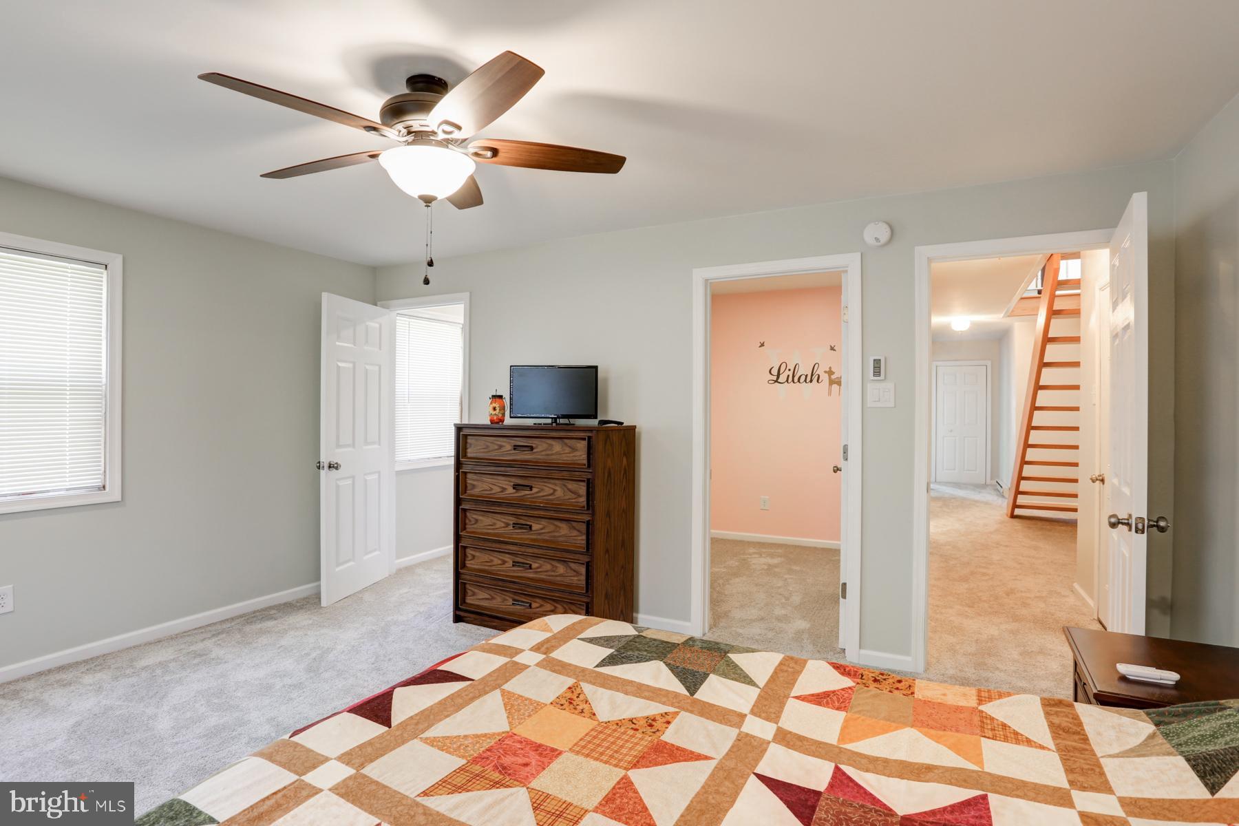 680 Powells Valley Road Halifax, PA 17032 - Photo 20 of 44 a bedroom with a bed and a chandelier