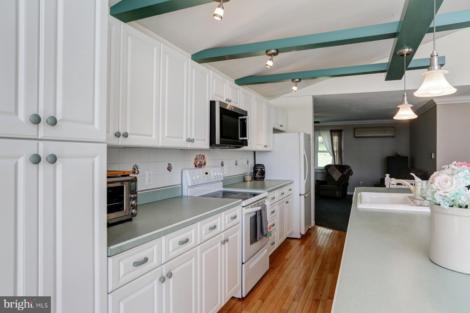 680 Powells Valley Road Halifax, PA 17032 - Photo 5 of 44 a kitchen with stainless steel appliances granite countertop a stove a sink and a refrigerator