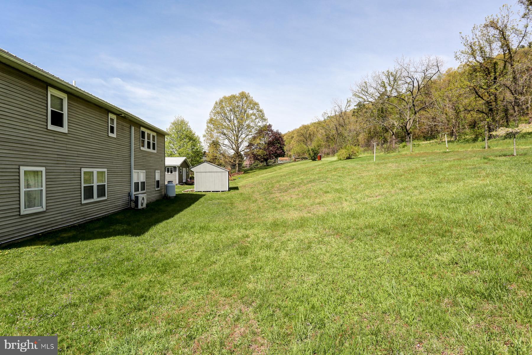 680 Powells Valley Road Halifax, PA 17032 - Photo 43 of 44 a yellow house with trees in front of it