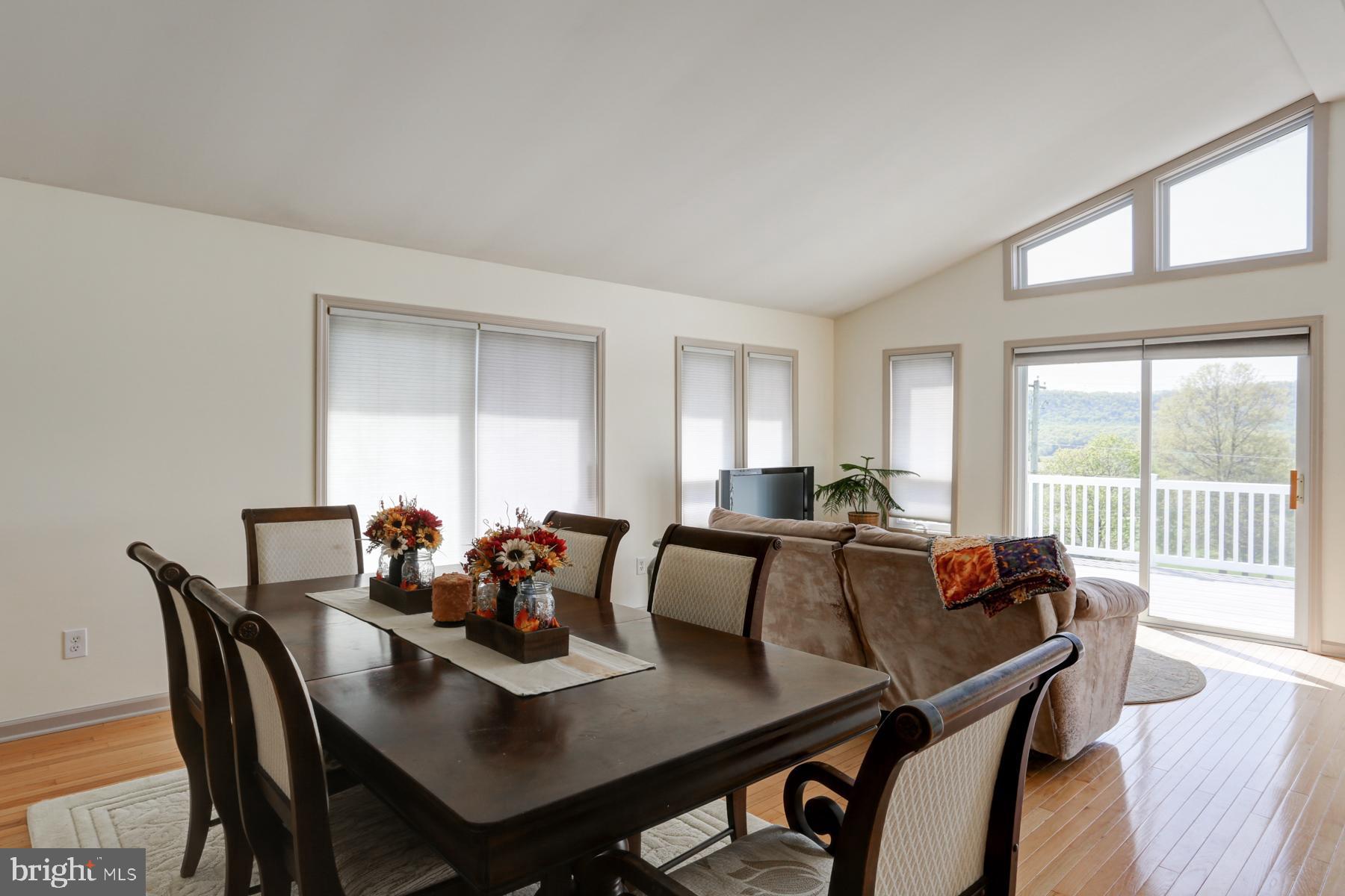 680 Powells Valley Road Halifax, PA 17032 - Photo 7 of 44 a view of a dining room with furniture and wooden floor