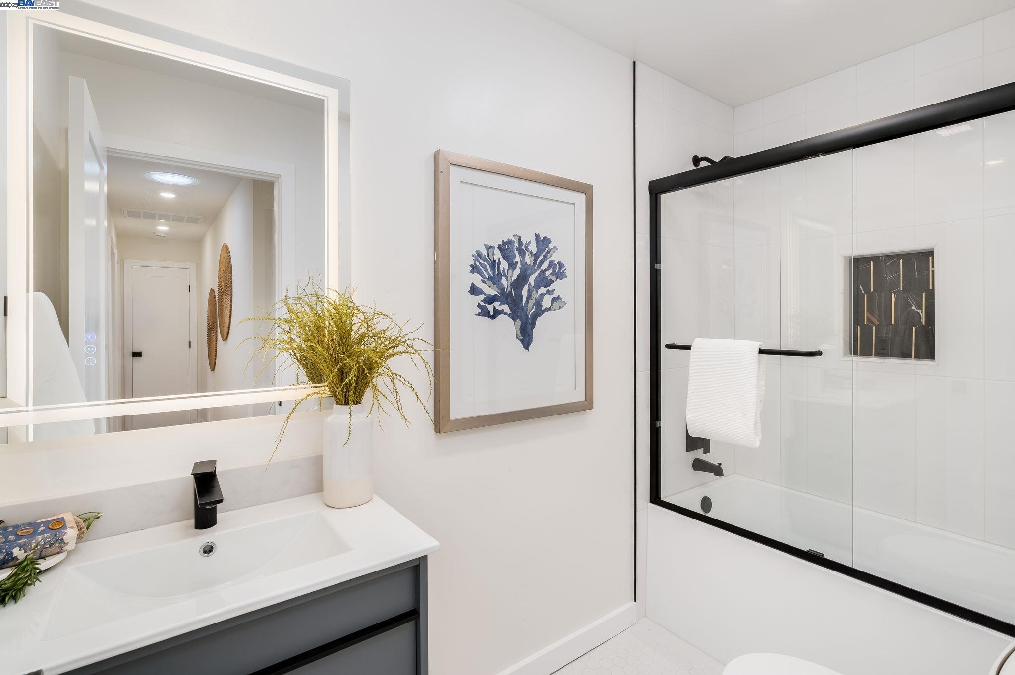 1425 Camino Verde Walnut Creek, CA 94597 - Photo 16 of 28 a bathroom with a sink and mirror with window