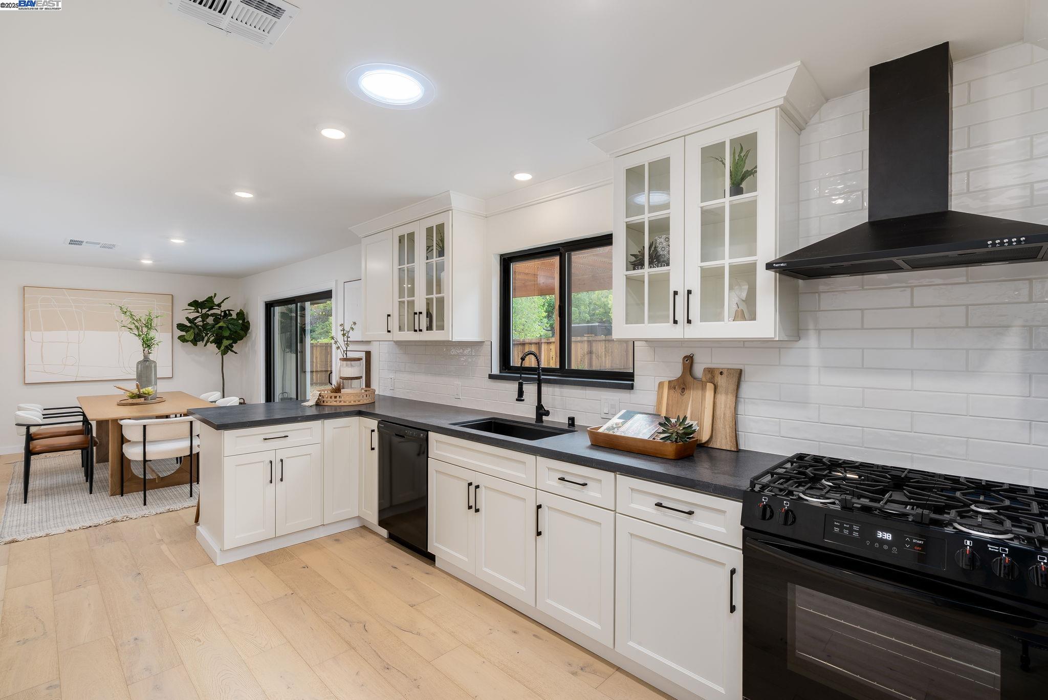 1425 Camino Verde Walnut Creek, CA 94597 - Photo 9 of 28 a kitchen with granite countertop a sink a stove and cabinets