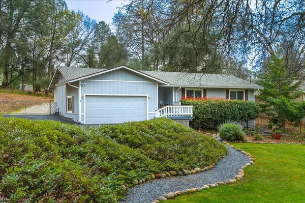 a house with trees in the background