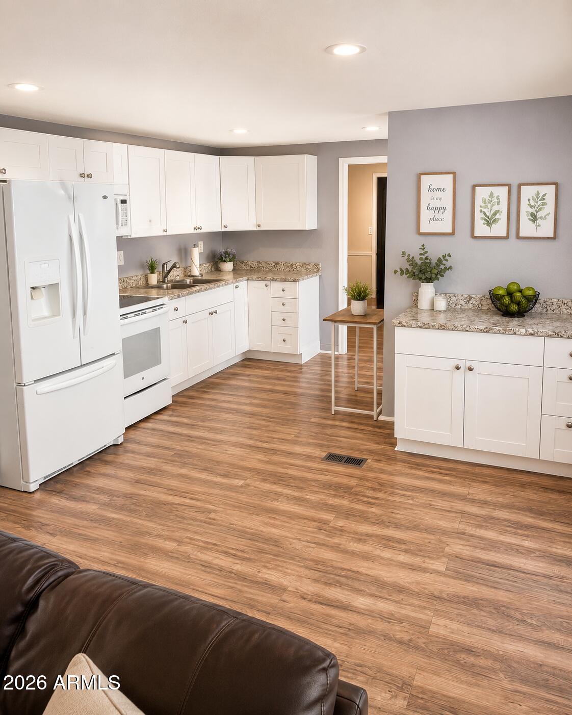 3330 East Main Street, Unit 332 Mesa, AZ 85213 - Photo 1 of 12 a kitchen with granite countertop a refrigerator and white cabinets