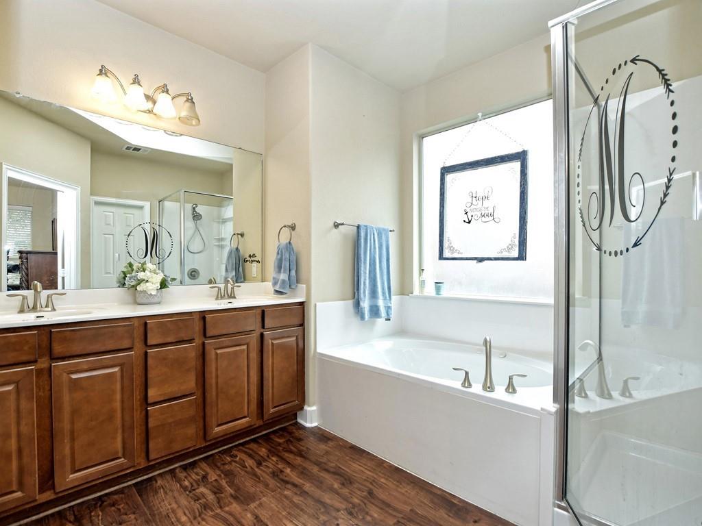 241 Caddo Lake Drive Georgetown, TX 78628 - Photo 14 of 25 a spacious bathroom with a tub sink and mirror