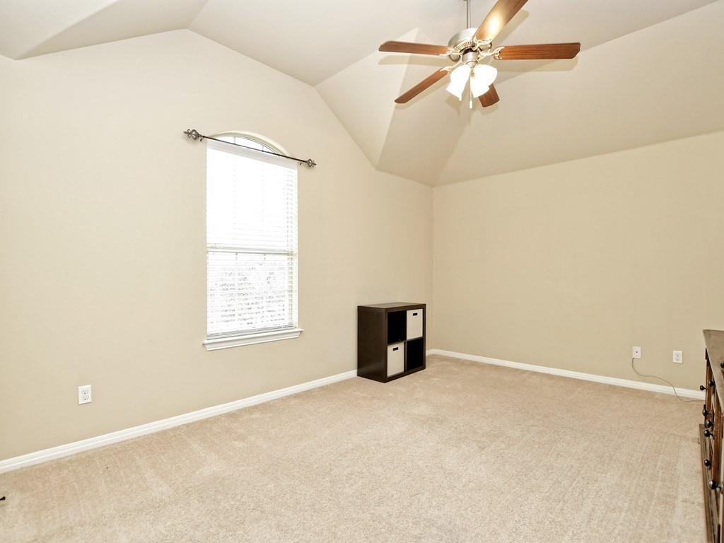 241 Caddo Lake Drive Georgetown, TX 78628 - Photo 18 of 25 an empty room with a window and a fan