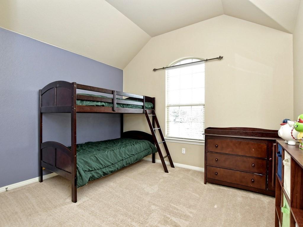 241 Caddo Lake Drive Georgetown, TX 78628 - Photo 20 of 25 a bedroom with a bed and a window